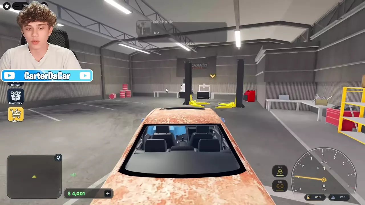Tutorial car facing the yellow lift arms inside the garage.